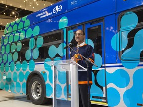 Edmonton Mayor Amarjeet Sohi announced on Tuesday, April 25, 2023, that the city is collaborating with the Alberta Motor Transport Association and The Transition Accelerator to build a hydrogen fuelling station in south Edmonton. He is standing in front of a hydrogen-powered city transit bus.
