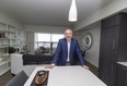 Robert McLeod, president and broker with McLeod Realty and Management Ltd., stands in a penthouse condo in the Sky Residences at Ice District, 66-storeys up, as the Full House Lottery unveils its early bird prize.