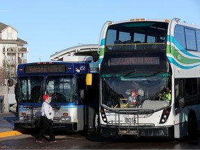 An Edmonton Transit Service bus and a Strathcona County Transit bus are seen at the West Clareview Transit Centre on Nov. 21, 2022.