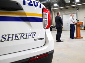 Public Safety and Emergency Services Minister Mike Ellis, left, and Alberta Sheriffs Chief Farooq Sheikh announce that a new fugitive apprehension unit is being launched using Alberta Sheriffs. The announcement took place in Calgary on Tuesday, April 25, 2023.