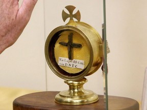 A glass case holds a relic of the 'Wood of the True Cross of our Lord' during a Sacred Relics exhibit in New Jersey in 2022.