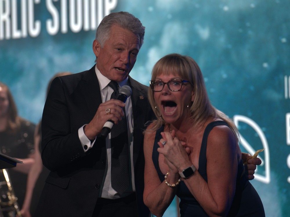 Emcee Danny Hooper, left, and Shelley Shank at the 31st Annual Sorrentino's Garlic Festival at the Expo Centre  in Edmonton on Saturday, April 29, 2023. 