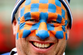 Edmonton Oilers fan Frank Ruszkowski poses for a photo prior the start of the Edmonton Oilers and Los Angeles Kings Game 5 NHL playoff action outside Rogers Place in Edmonton, Tuesday April 25, 2023. Ruszkowski is wearing an Oilers' colour version of the face paint Will Ferrell recently wore.