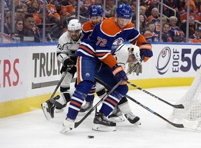 The Edmonton Oilers' Nick Bjugstad (72) and Brett Kulak (27) battles the Los Angeles Kings' Viktor Arvidsson (33) and Trevor Moore (12) during second period NHL playoff action at Rogers Place in Edmonton, Tuesday April 25, 2023.