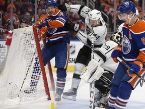 The Edmonton Oilers' Zach Hyman (18) scores his second goal of the game while being checked by the Los Angeles Kings' Mikey Anderson (44) during third period NHL playoff action at Rogers Place in Edmonton, Tuesday April 25, 2023. The Oilers won 6-3.