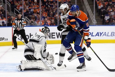 The Edmonton Oilers' Evander Kane (91) battles the Los Angeles Kings' Alex lafallo (19) and goalie Pheonix Copley (29) during third period NHL playoff action at Rogers Place in Edmonton, Tuesday April 25, 2023. The Oilers won 6-3.