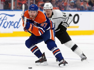 The Edmonton Oilers' Connor McDavid (97) battles the Los Angeles Kings' Mikey Anderson (44) during first period NHL playoff action at Rogers Place in Edmonton, Tuesday April 25, 2023.