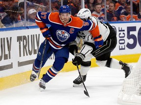 The Edmonton Oilers' Connor McDavid (97) battles the Los Angeles Kings' Anze Kopitar (11) during first period NHL playoff action at Rogers Place in Edmonton, Tuesday April 25, 2023.
