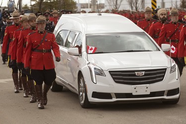 The funeral procession heads to Millennium Place during the regimental funeral for Const. Harvinder Singh Dhami in Sherwood Park, Alta., Thursday April 20, 2023.