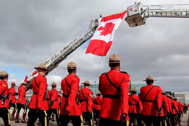 RCMP members march in a regimental funeral procession for Const. Harvinder Singh Dhami in Sherwood Park, Alta., Thursday April 20, 2023.