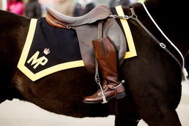 A riderless horse with the boots reversed takes part in the regimental funeral procession for Const. Harvinder Singh Dhami in Sherwood Park, Alta., Thursday April 20, 2023.