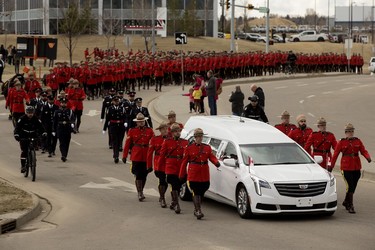The funeral procession heads to Millennium Place during the regimental funeral for Const. Harvinder Singh Dhami in Sherwood Park, Alta., Thursday April 20, 2023.