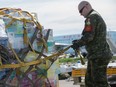 Traffic Technician, Corporal Claude Lamarche prepares a pallet of relief goods to be transported from Edmonton to Fort McMurray, Alberta, on May 7, 2016, as part of the Canadian Armed Forces' support to the Province of Alberta's emergency response to wildfires in Fort McMurray.  Photo: Cpl Manuela Berger, 4 Wing Imaging CK01-2016-0428-015 ORG XMIT: CK2016-0428