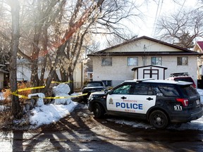 Police remain on the scene following a suspicious death at a home along 122 Street and 109 Avenue in Edmonton, Monday April 3, 2023. The police homicide section is taking over the investigation.