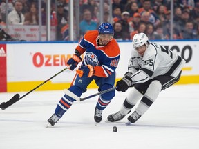 Evander Kane (91) of the Edmonton Oilers, breaks into the offensive zone against Quinton Byfield f the Los Angles Kings at Rogers Place in Edmonton on March 30, 2023.