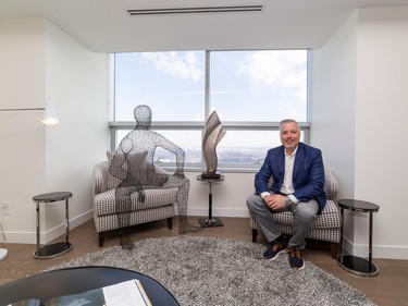 Robert McLeod President & Broker of McLeod Realty & Management Ltd sits in the penthouse condo in the Sky Residences at Ice District 66 storeys up as Full House Lottery unveils its Early Bird prize in support of the Royal Alex and University of Alberta Hospitals. Taken on Wednesday, April 5, 2023 .   Greg Southam-Postmedia