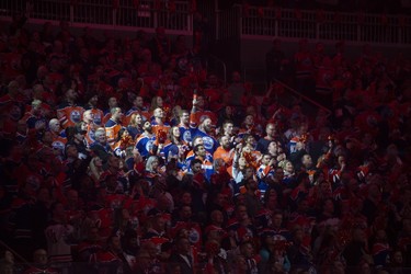 Fans of the Edmonton Oilers, sing the national anthem prior to the game against the Los Angeles Kings at Rogers Place in Edmonton on April 19, 2023.