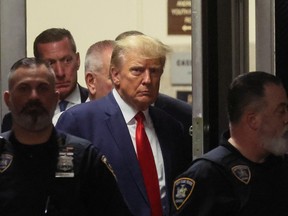 Former U.S. President Donald Trump arrives at Manhattan Criminal Courthouse, after his indictment by a Manhattan grand jury following a probe into hush money paid to porn star Stormy Daniels, in New York City, U.S., April 4, 2023.