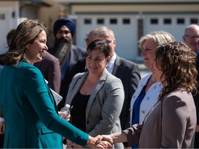 UCP Leader Danielle Smith greets UCP MLAs after a news conference marking the beginning of the 2023 provincial election on Monday, May 1, 2023, in Calgary.
