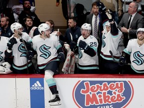 The Seattle Kraken celebrate their 2-1 win against the Colorado Avalanche in Game Seven of the First Round of the 2023 Stanley Cup Playoffs at Ball Arena on April 30, 2023 in Denver, Colorado. (Photo by Matthew Stockman/Getty Images)