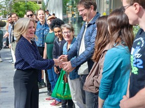 NDP leader Rachel Notley greats supporters after voting at an advance poll at the Central Library in Calgary on Tuesday, May 23, 2023.