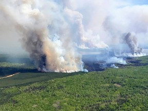 Smoke rises from the WWF023 wildfire near Fox Creek, Alberta, Canada May 13, 2023.