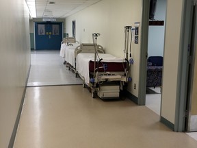 Hospital beds sit in the hallway at the Misericordia Hospital in Edmonton, AB., on Monday, Feb 10, 2014.  Perry Mah/   Edmonton Sun/ QMI Agency