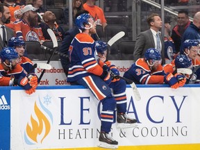 Edmonton Oilers' Connor McDavid (97) sits on the boards as the Vegas Golden Knights celebrate the win during NHL Stanley Cup second round playoff action in Edmonton on Sunday May 14, 2023.THE CANADIAN PRESS/Jason Franson