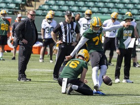 Head coach and general manager Chris Jones watches kicker Dean Faithfull at Edmonton Elks training camp on May 14, 2023, in Edmonton.