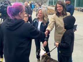 Alberta NDP Leader Rachel Notley and Alberta UCP Leader Danielle Smith meet with evacuees from Alberta wildfires at the Edmonton Expo Centre on May 7, 2023. Photo courtesy of Twitter @ABDanielleSmith