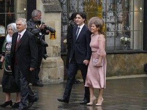 Canadian Prime Minister Justin Trudeau, center left, and Sophie Trudeau arrive at Westminster Abbey prior to the coronation ceremony of Britain's King Charles III in London Saturday, May 6, 2023.