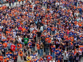 People take part in the Edmonton Oilers watch party in the Ice District on May 6, 2023, in Edmonton.