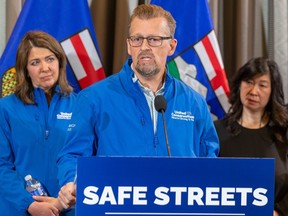 Ellis, UCP candidate for Calgary West makes an announcement to improve public safety as Danielle Smith, Leader of the United Conservative Party and Holly Mah, chairwoman of the Chinatown Business Association, listen on Tuesday, May 9, 2023 in Edmonton.