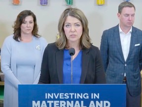 Danielle Smith answers questions during a news conference in Calgary on May 13, 2023.