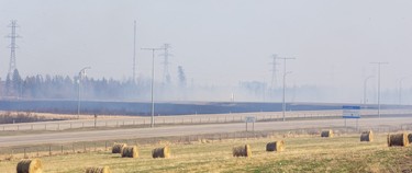 Fire burns near the Anthony Henday and 111 Avenue on Monday, May 1, 2023 in Edmonton.