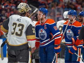 Connor McDavid (97) of the Edmonton Oilers, shakes hands with Adin Hill of the Las Vegas Golden Knights after game six of the second round of the NHL playoffs at Rogers Place in Edmonton on May 14, 2023. The Golden Knights advanced in the playoffs after taking the series four games to two. Photo by Shaughn Butts-Postmedia