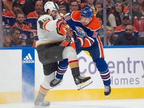 Zach Hyman (18)of the Edmonton Oilers, collides with Nicolas Hague of the Las Vegas Golden Knights at Rogers Place in Edmonton on May 8, 2023 Photo by Shaughn Butts-Postmedia