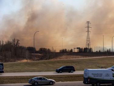 Fire burns near Anthony Henday Drive and Yellowhead Trail on Monday, May 1, 2023, in Edmonton.