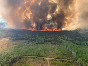 Hot and dry conditions are expected to continue as wildfires throughout western Canada have forced thousands of evacuations and air quality warnings due to smoke as far east as northern Ontario. The Bald Mountain Wildfire is shown in the Grande Prairie Forest Area on Friday May 12, 2023 this handout image provided by the Government of Alberta.
