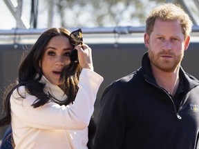 FILE - Prince Harry and Meghan Markle, Duke and Duchess of Sussex visit the track and field event at the Invictus Games in The Hague, Netherlands, Sunday, April 17, 2022.