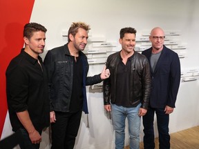 Nickelback band members from left; Daniel Adair, Chad Kroeger, Ryan Peake and Mike Kroeger are inducted into the Canadian Music Hall of Fame at Studio Bell in Calgary on Sunday, June 25, 2023. Gavin Young/Postmedia