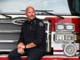 Nanton Fire Department volunteer member Shawn Wiebe at the fire hall south of Calgary on June 9, 2023. Wiebe was immortalized by a former Calgary Sun photographer as the firefighter rescued Shiela Rowland during the High River flood. The image went viral, appearing all over the world in newspapers, magazine covers, billboards in Canada, the U.S., Europe and beyond.