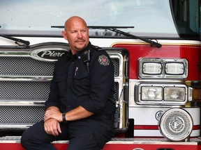 Nanton Fire Department volunteer member Shawn Wiebe at the fire hall south of Calgary on June 9, 2023. Wiebe was immortalized by a former Calgary Sun photographer as the firefighter rescued Shiela Rowland during the High River flood. The image went viral, appearing all over the world in newspapers, magazine covers, billboards in Canada, the U.S., Europe and beyond.