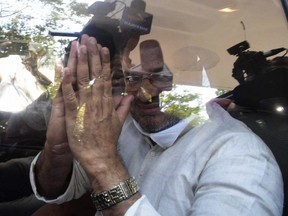 FILE- Bishop Franco Mulakkal greets the media as he leaves a court in Kottayam, India, Friday, Jan. 14, 2022.