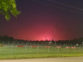 The red glow from a fire is shown in Edson, Alberta on Friday June 9, 2023. Officials in Alberta say extreme fire behavior is anticipated on a wildfire that prompted the evacuation of the Town of Edson early Friday evening, and local leaders are urging anyone who has stayed behind to get out now. THE CANADIAN PRESS/HO-Government of Alberta- Alberta Wildfire-Wildfire information officer Caroline Charbonneau