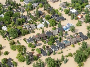 Inner city homes in Calgary's southwest, adjacent to the Elbow River, sit underwater on June 21, 2013. Ted Rhodes, Calgary Herald