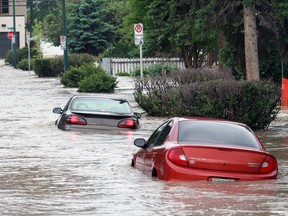 A street flooded by the Elbow River in Erlton on Friday morning June 21, 2013. Photo by Gavin Young/Calgary Herald