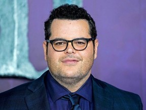 Josh Gad poses on the red carpet as he arrives to attend the European premiere of the film