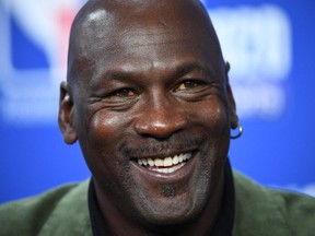 Michael Jordan looks on as he addresses a press conference ahead of the NBA basketball match between Milwaukee Bucks and Charlotte Hornets at The AccorHotels Arena in Paris on January 24, 2020.