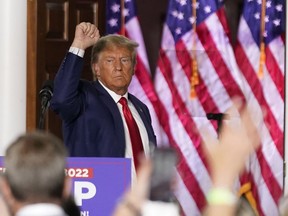 Former President Donald Trump gestures after speaking at Trump National Golf Club in Bedminster, N.J., Tuesday, June 13, 2023, after pleading not guilty in a Miami courtroom earlier in the day to dozens of felony counts that he hoarded classified documents and refused government demands to give them back.